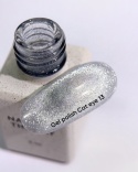 NAILSOFTHEDAY Cat Eye Gel Polish 13 - srebrny lakier hybrydowy z intensywnym efektem "kocie oko", 6 ml